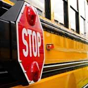 Stop sign on side of school bus